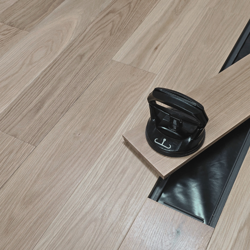 A single plank removed from a solid wood floor. Steller Floors has a wide range of options for every budget