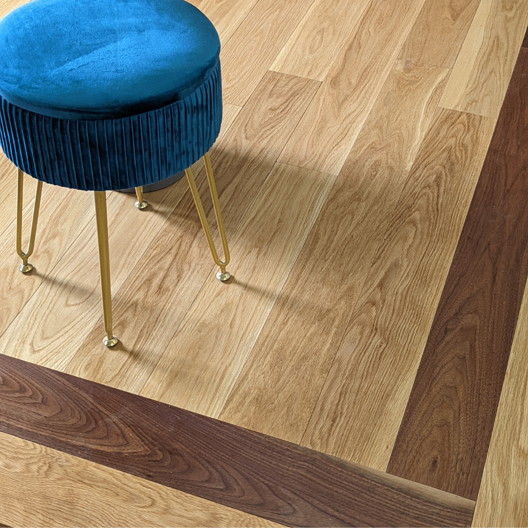Wooden flooring with a blue stool on top