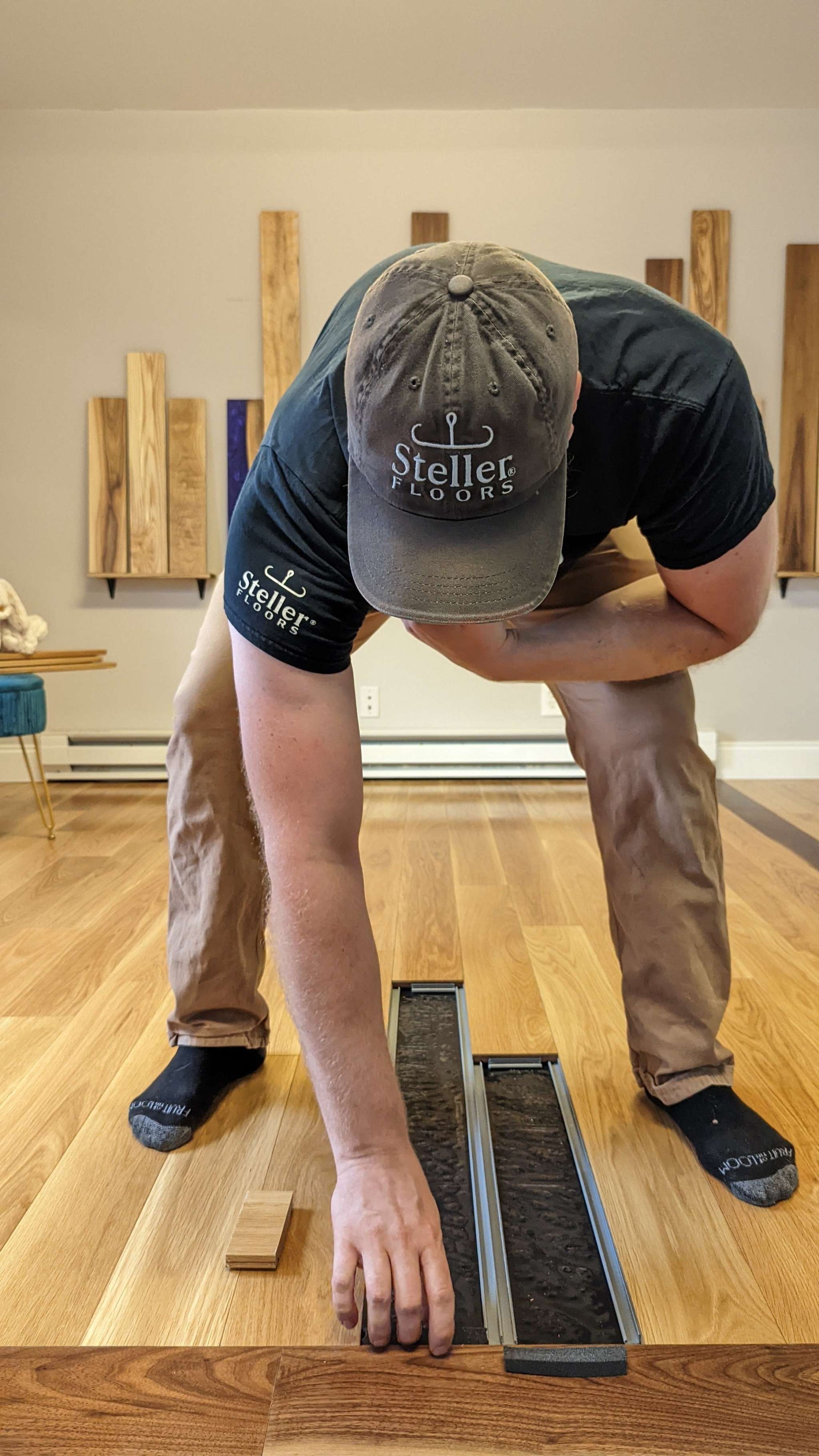 Man demonstrating flooring installation during remote Steller Floors training session.